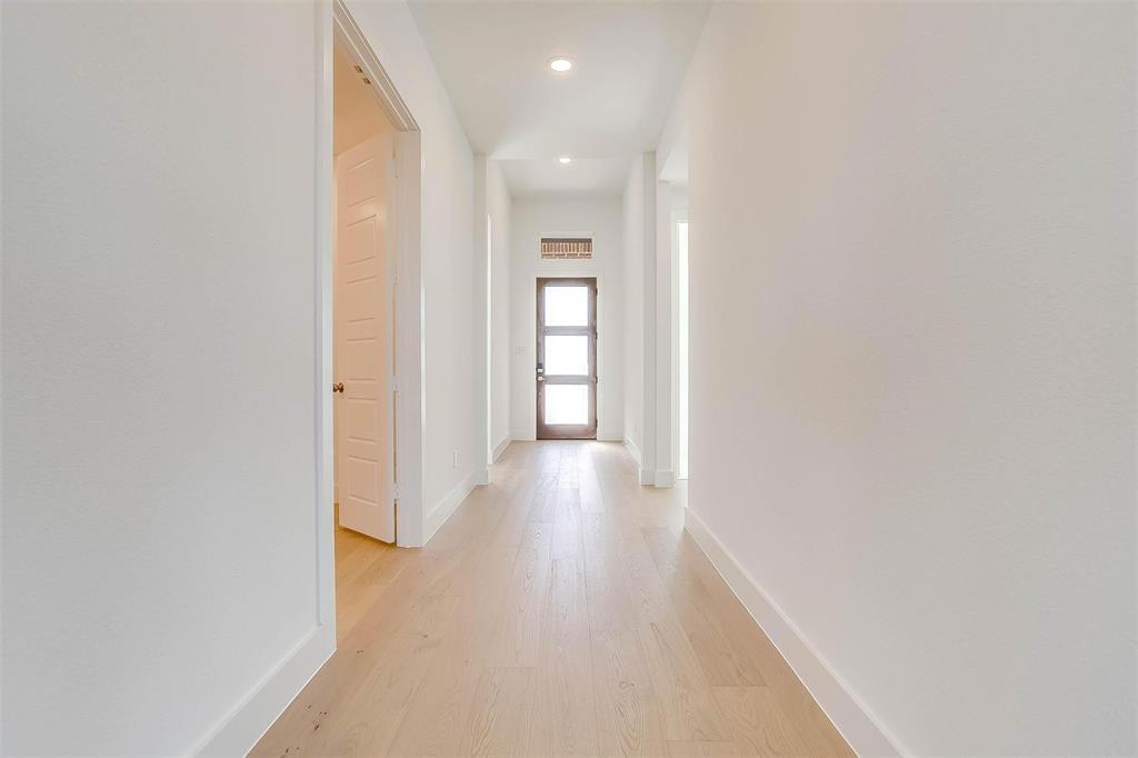 826 Feathergrass Place Haslet, TX 76052 - Photo 4 of 35 a view of hallway with wooden floor