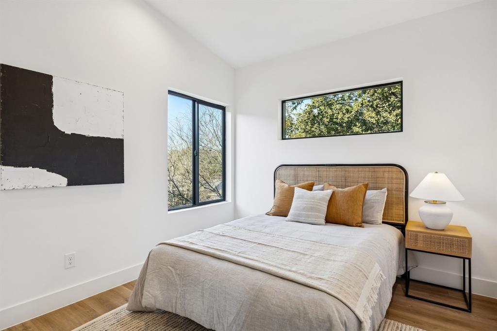 2147 Mail Avenue, Unit 103 Dallas, TX 75235 - Photo 14 of 16 a bedroom with a bed and window