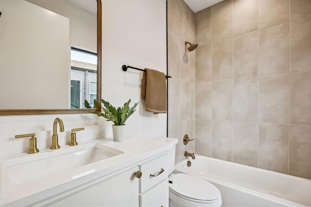2147 Mail Avenue, Unit 103 Dallas, TX 75235 - Photo 16 of 16 a bathroom with a sink a toilet and shower