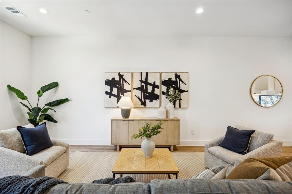 2147 Mail Avenue, Unit 103 Dallas, TX 75235 - Photo 6 of 16 a living room with furniture flowerpot and wooden floor