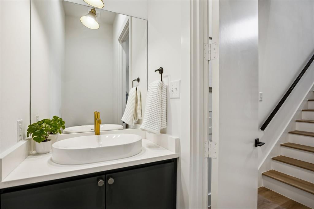 2147 Mail Avenue, Unit 103 Dallas, TX 75235 - Photo 10 of 16 a bathroom with a sink and a mirror