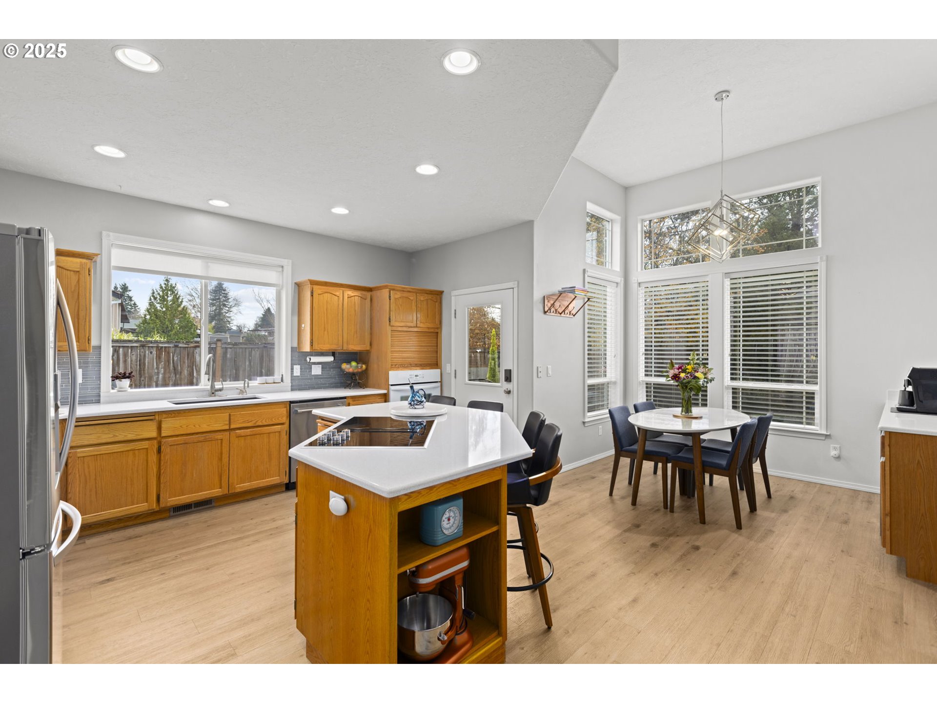 1249 Southeast Williams Avenue Gresham, OR 97080 - Photo 11 of 38 a kitchen with stainless steel appliances granite countertop a sink a counter top space and living room view