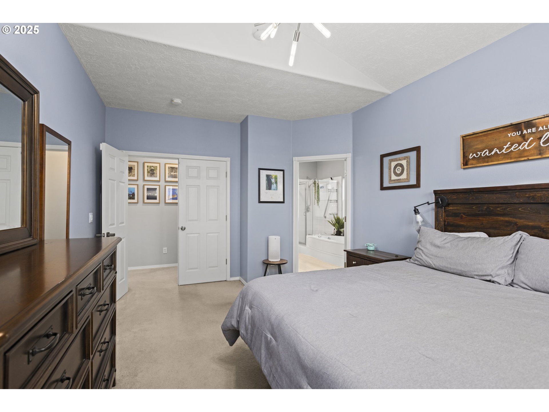 1249 Southeast Williams Avenue Gresham, OR 97080 - Photo 22 of 38 a bedroom with a bed and a flat screen tv