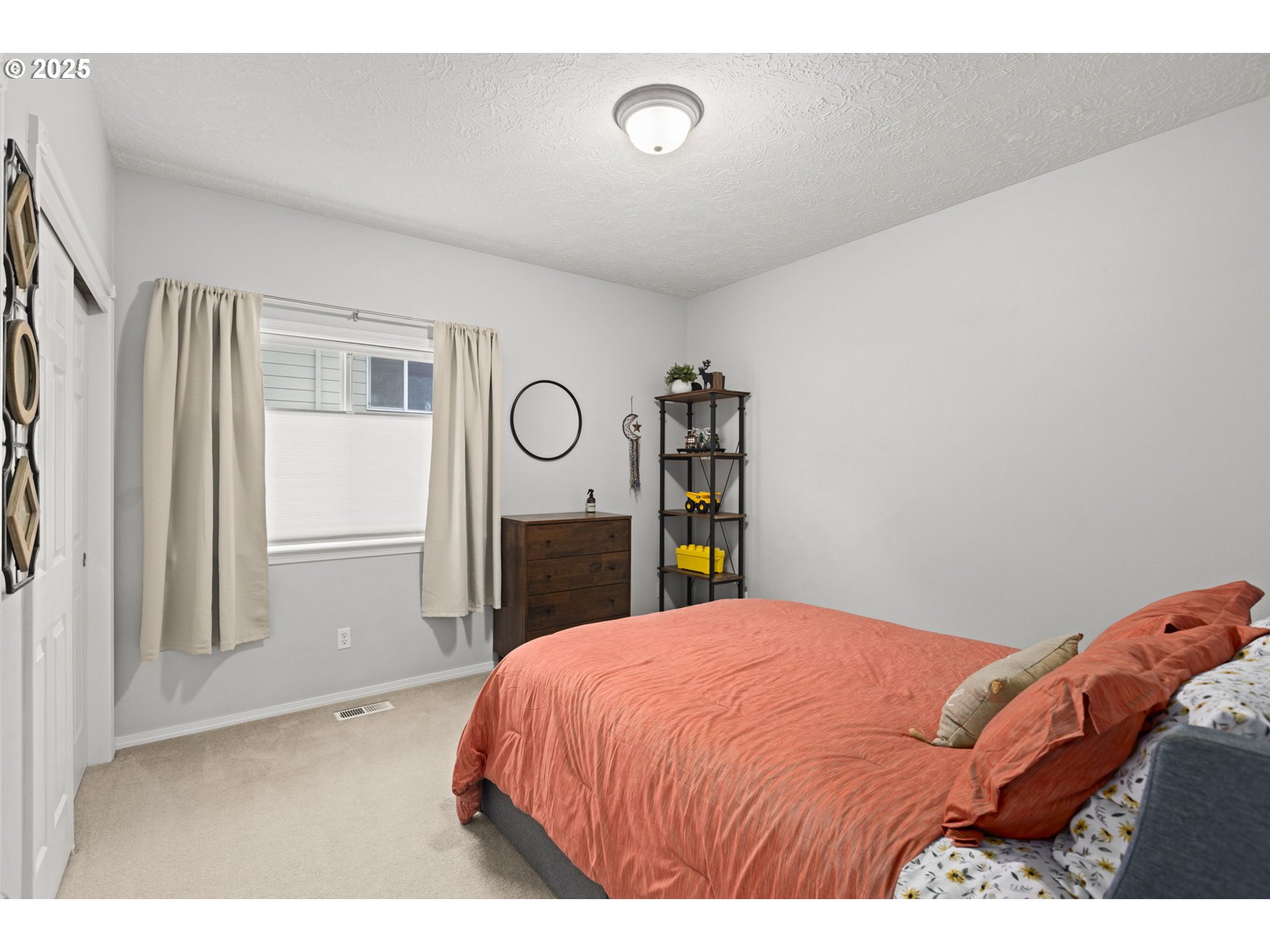 1249 Southeast Williams Avenue Gresham, OR 97080 - Photo 26 of 38 a bedroom with a bed and window