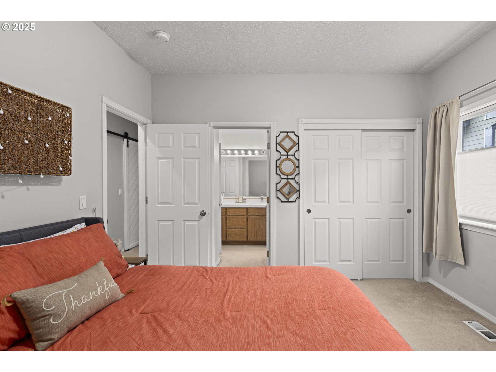 1249 Southeast Williams Avenue Gresham, OR 97080 - Photo 27 of 38 a bedroom with a bed and a cabinets