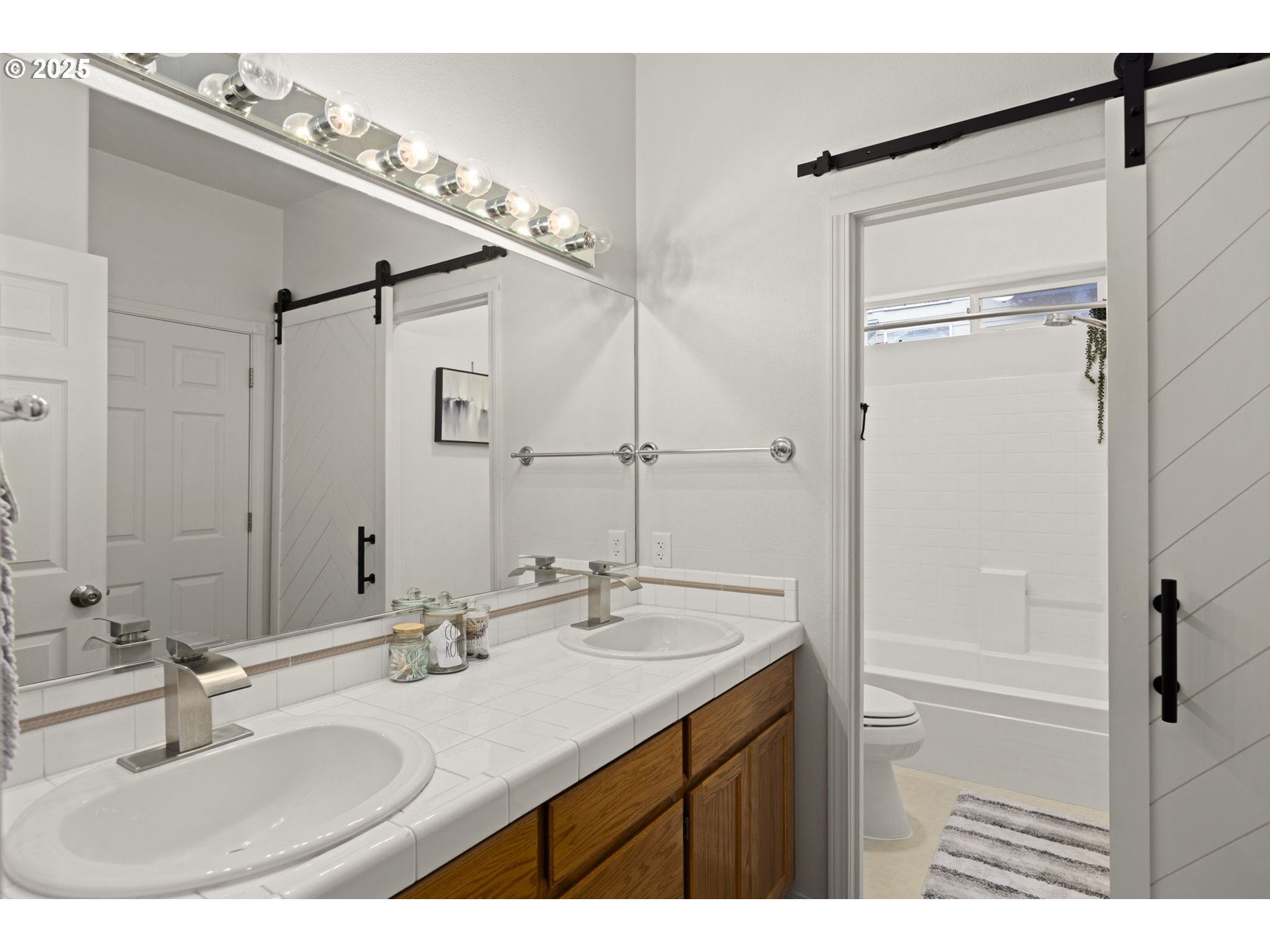 1249 Southeast Williams Avenue Gresham, OR 97080 - Photo 28 of 38 a bathroom with a sink and a mirror