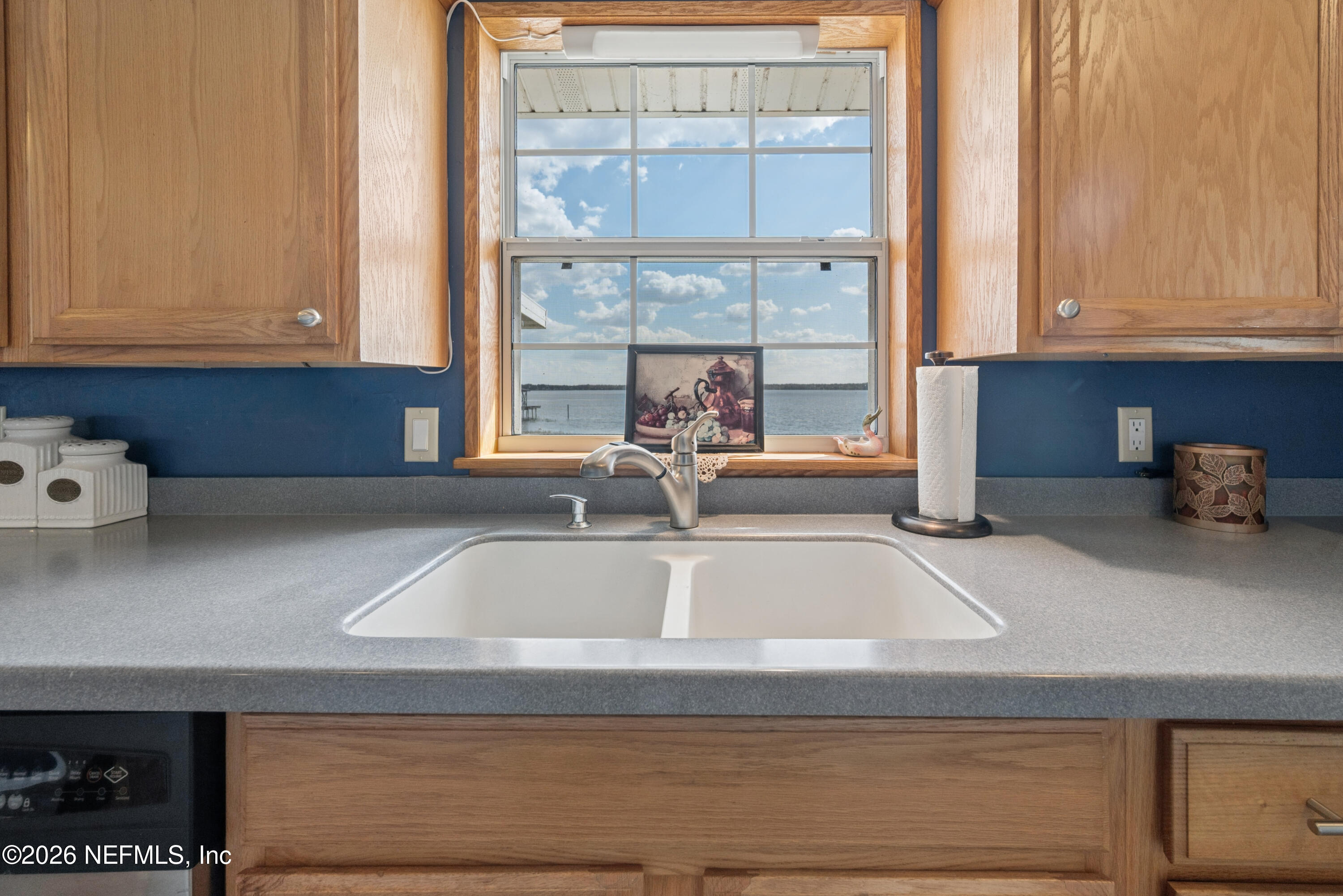 7932 Southwest County Road 18 Hampton, FL 32044 - Photo 17 of 39 a kitchen with granite countertop a sink and a window