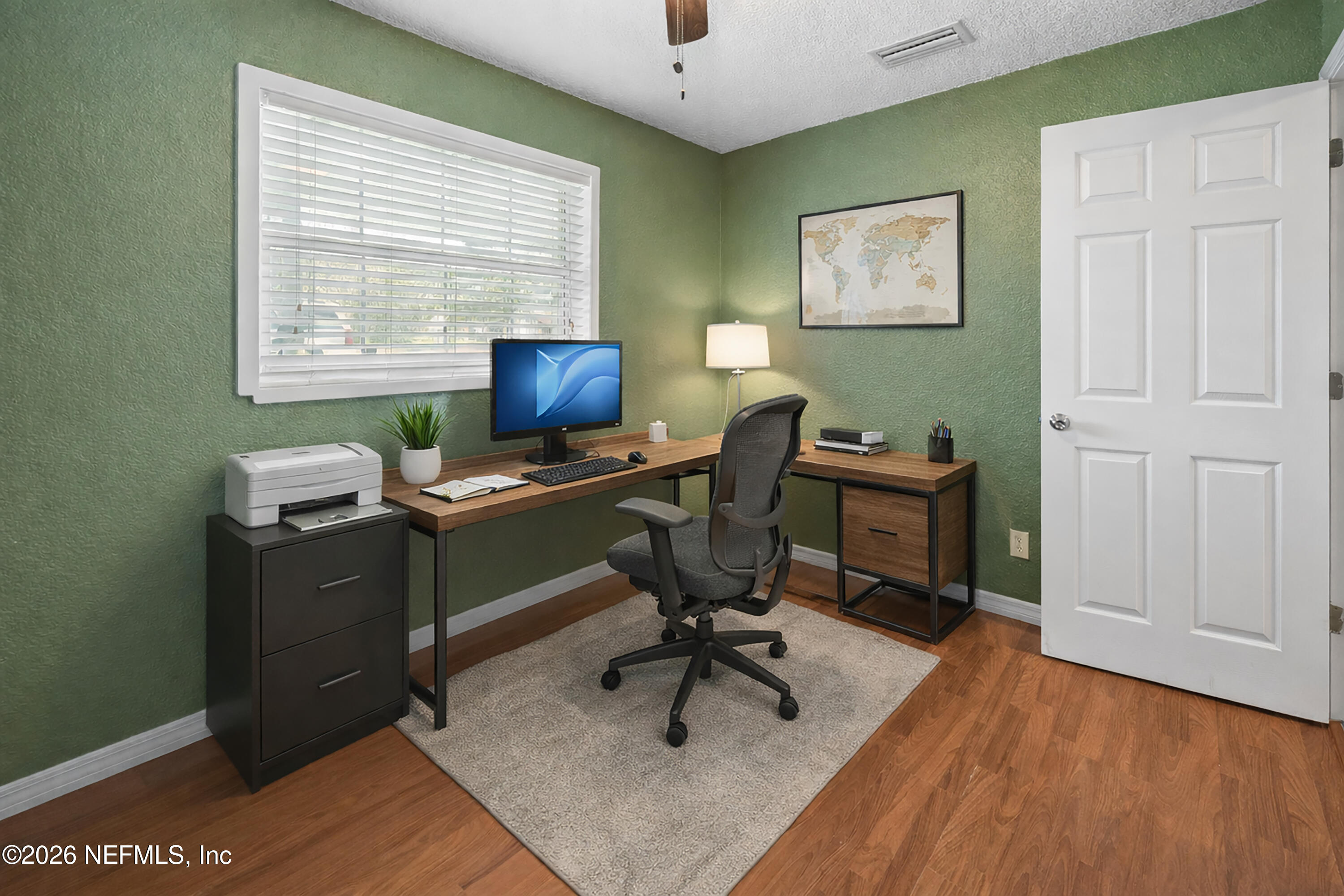 7932 Southwest County Road 18 Hampton, FL 32044 - Photo 23 of 39 a view of a workspace with furniture and a window