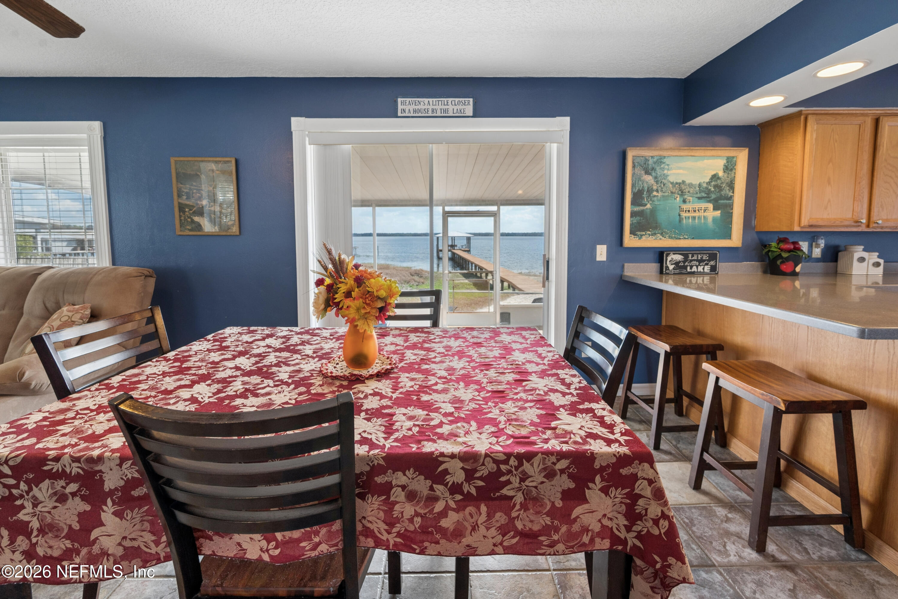 7932 Southwest County Road 18 Hampton, FL 32044 - Photo 25 of 39 a bedroom with a bed and a large window