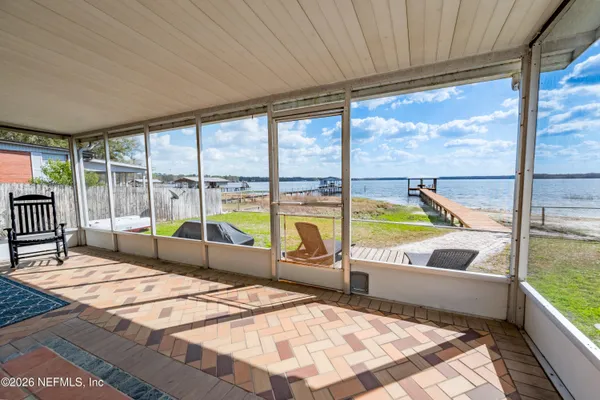 a house view with a sitting space and balcony