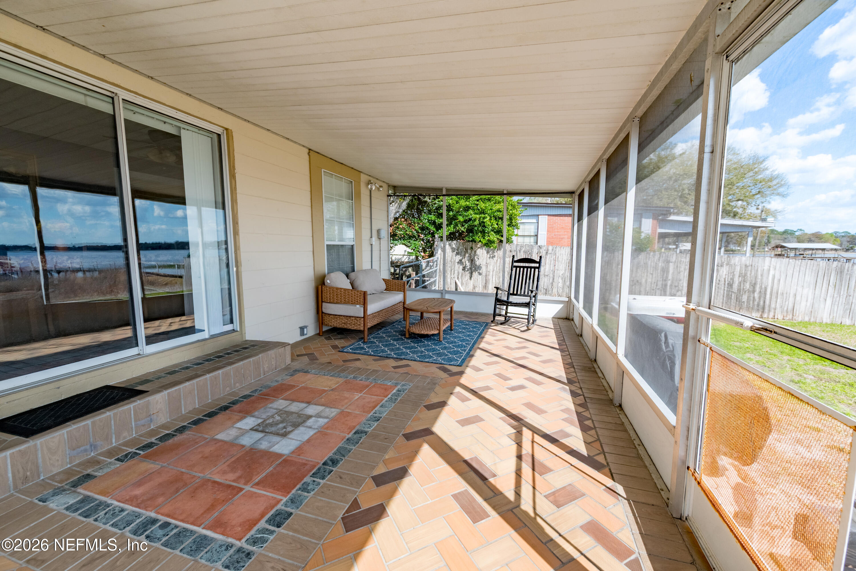 7932 Southwest County Road 18 Hampton, FL 32044 - Photo 27 of 39 a house view with a sitting space and balcony