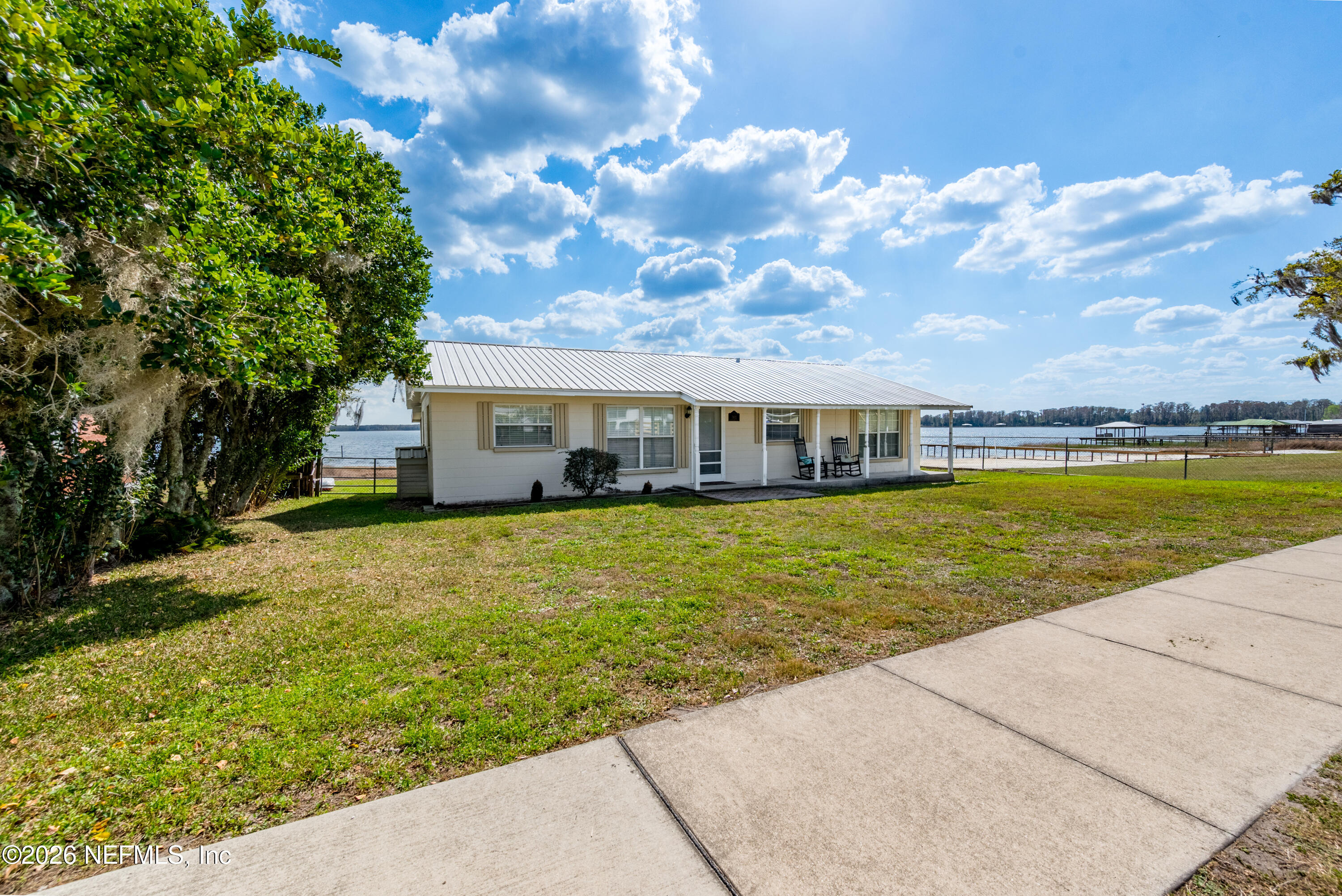 7932 Southwest County Road 18 Hampton, FL 32044 - Photo 3 of 39 a front view of house with yard and ocean