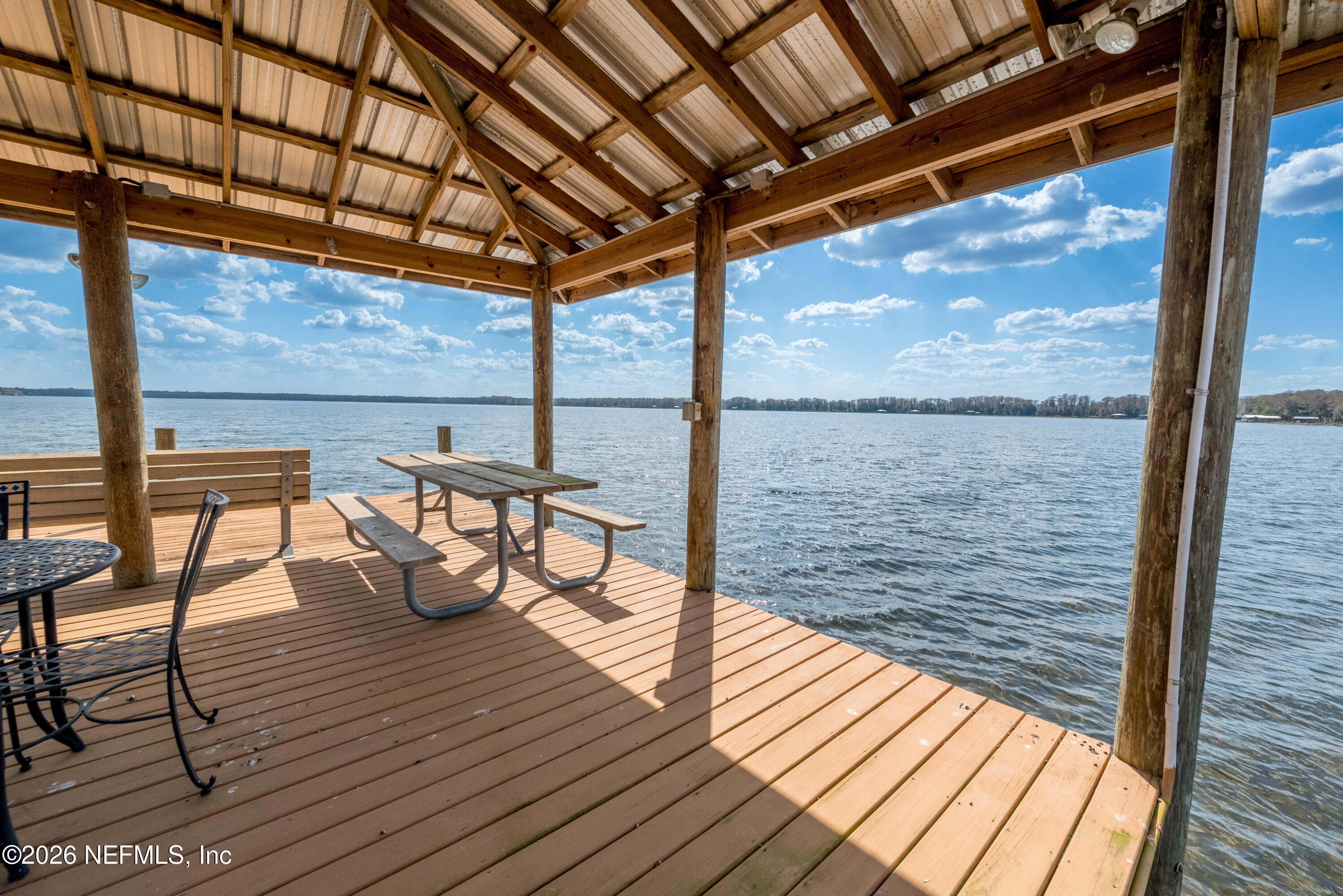 7932 Southwest County Road 18 Hampton, FL 32044 - Photo 32 of 39 a view of a balcony with chairs and wooden floor