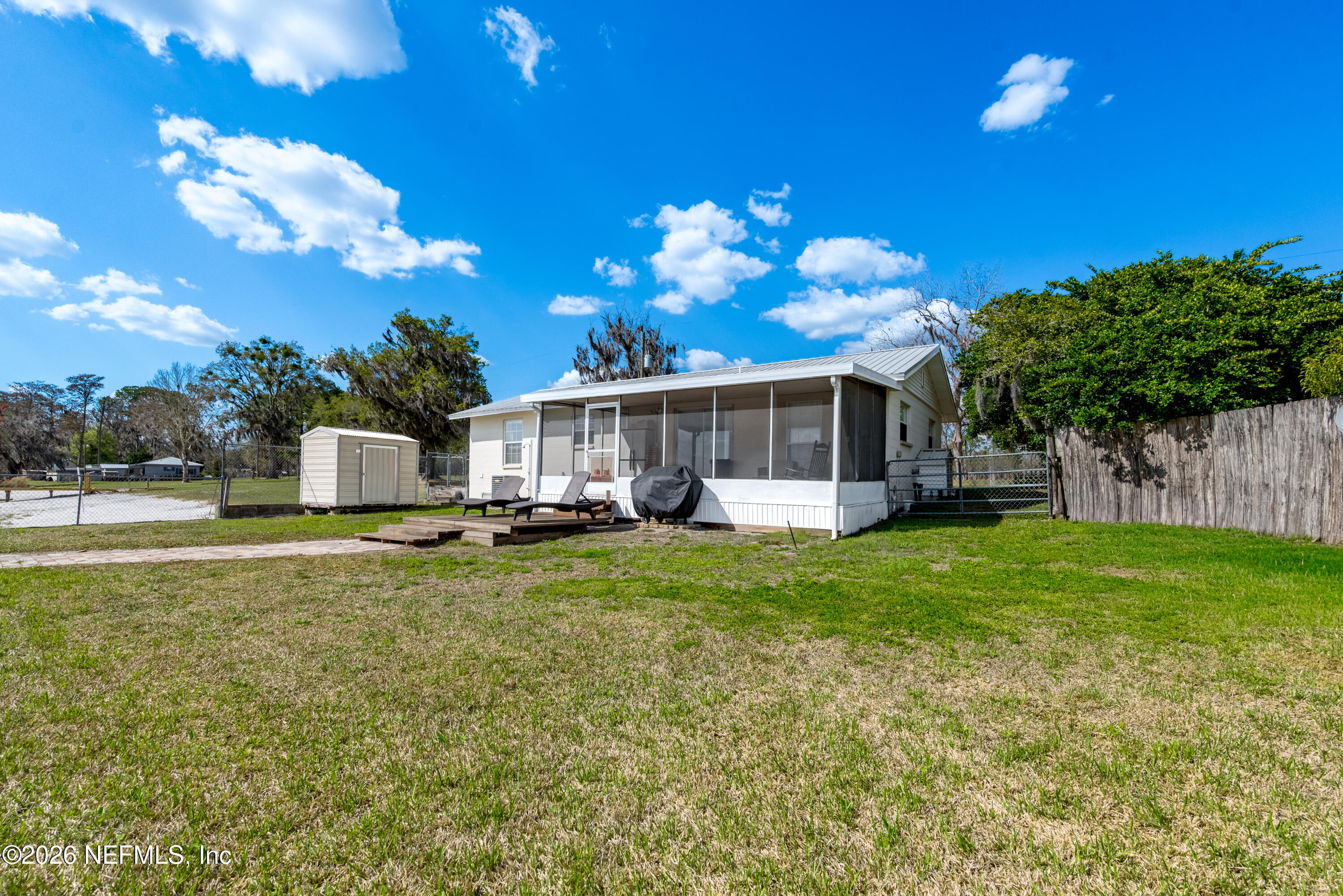 7932 Southwest County Road 18 Hampton, FL 32044 - Photo 34 of 39 a front view of a house with a yard