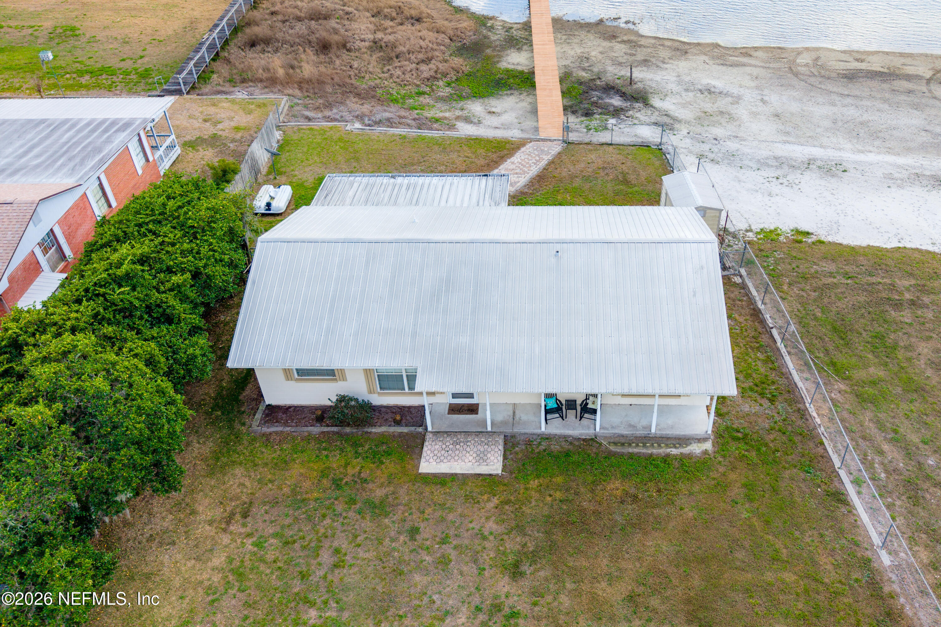 7932 Southwest County Road 18 Hampton, FL 32044 - Photo 35 of 39 a view of swimming pool with seating area and trees around