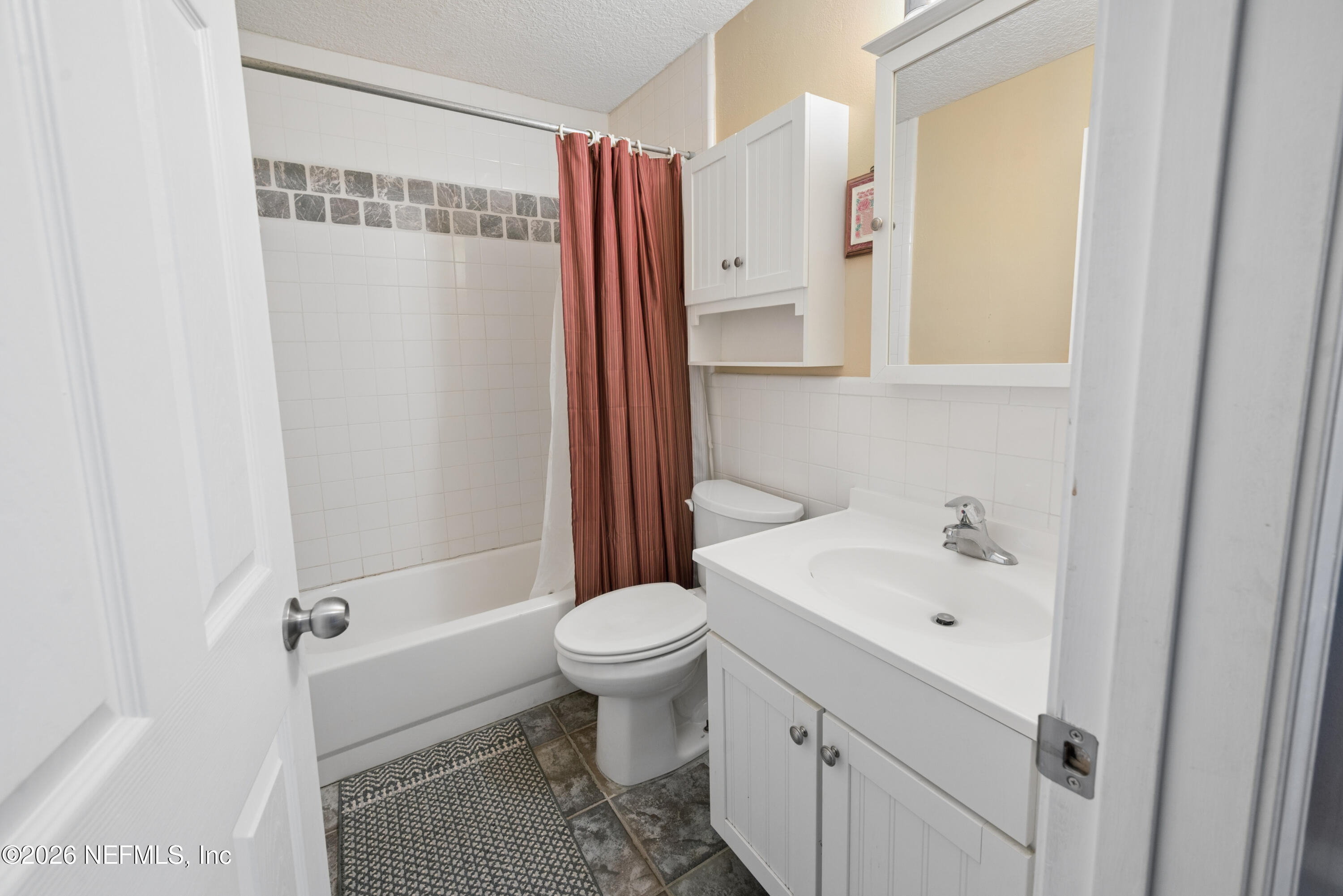 7932 Southwest County Road 18 Hampton, FL 32044 - Photo 38 of 39 a bathroom with a sink a toilet and shower