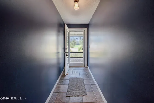 a hallway with a wooden cabinets