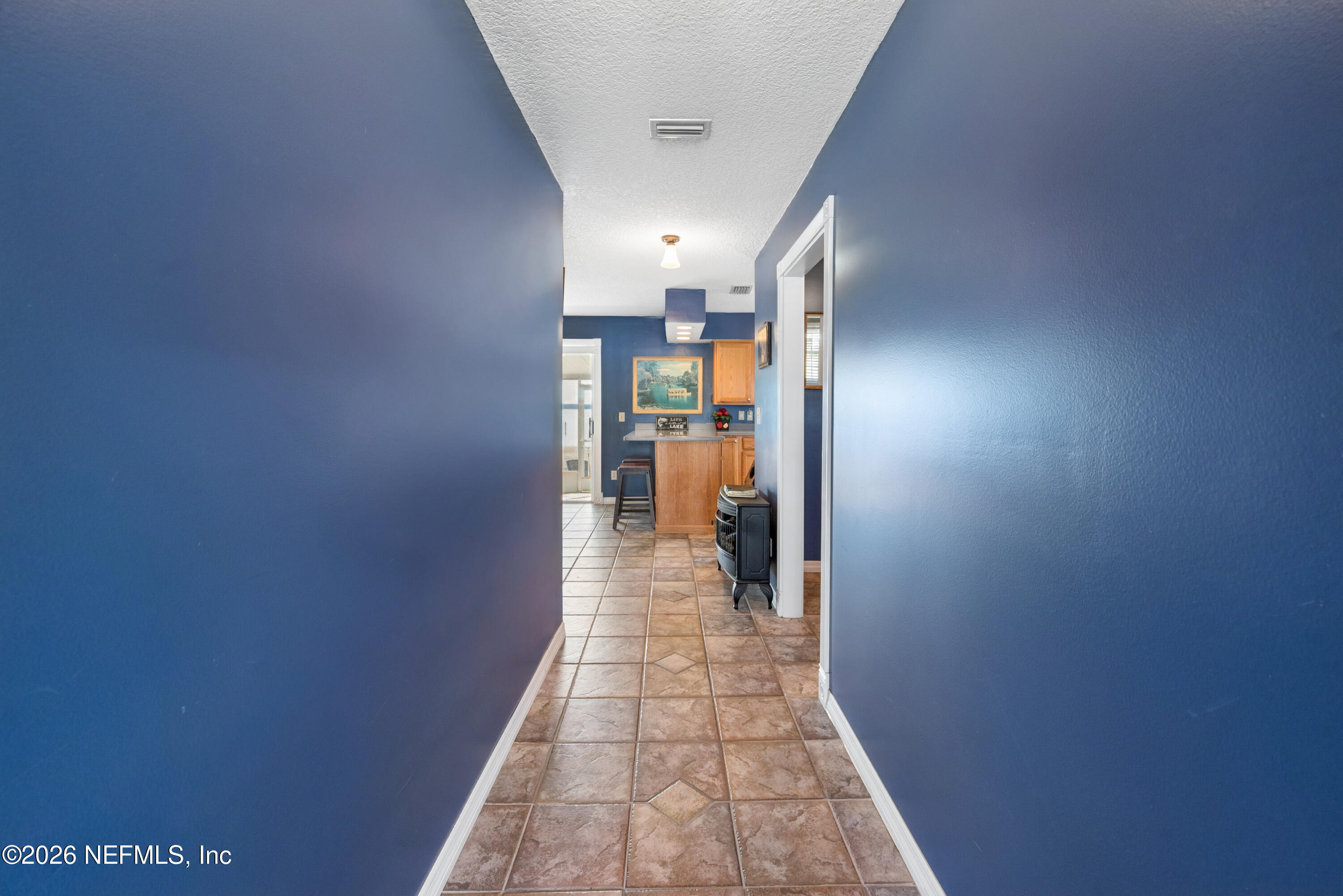 7932 Southwest County Road 18 Hampton, FL 32044 - Photo 8 of 39 a hallway with a wooden cabinets