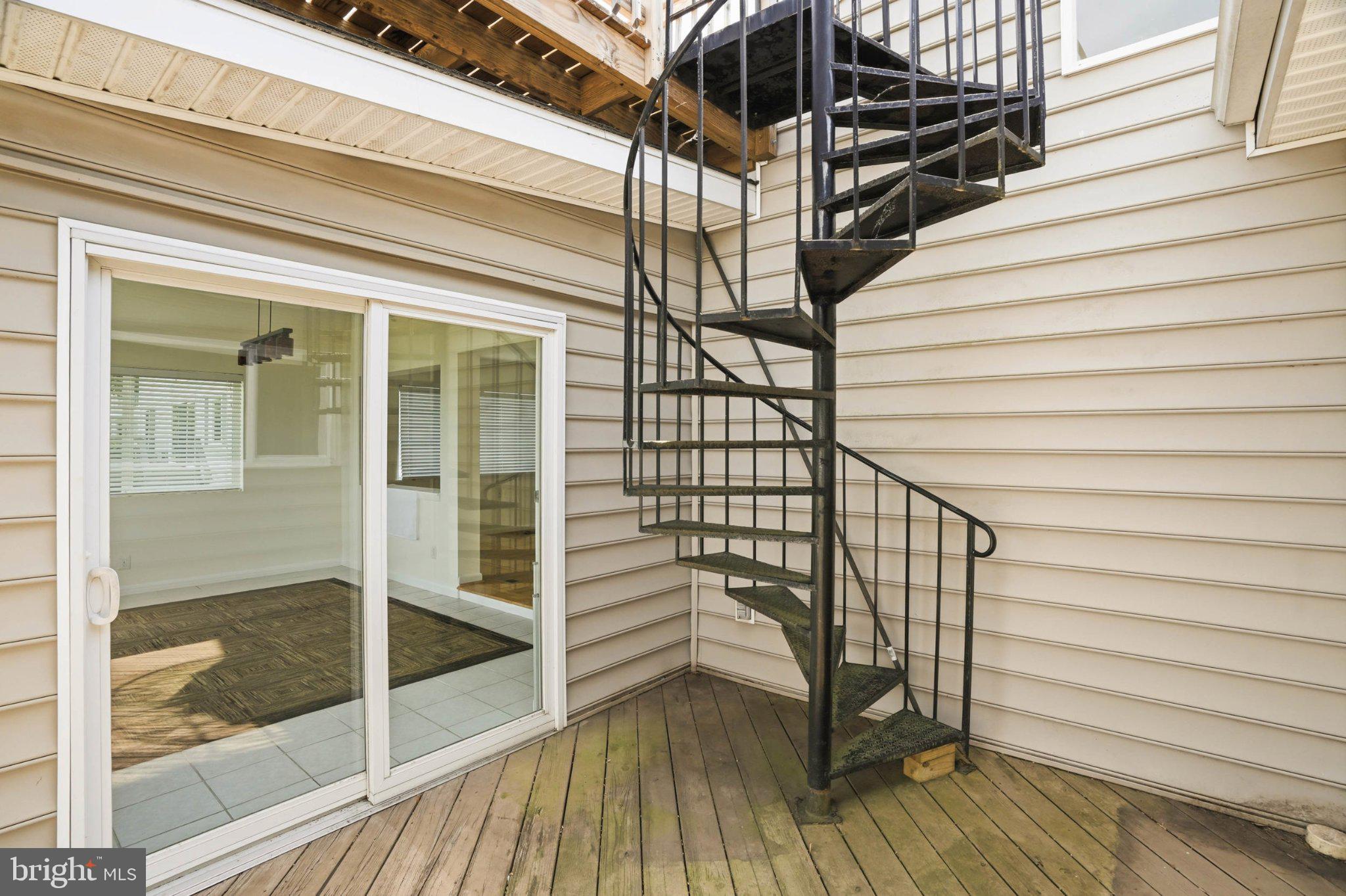 1100 River Bay Road Annapolis, MD 21409 - Photo 42 of 67 Charming spiral staircase invites exploration.