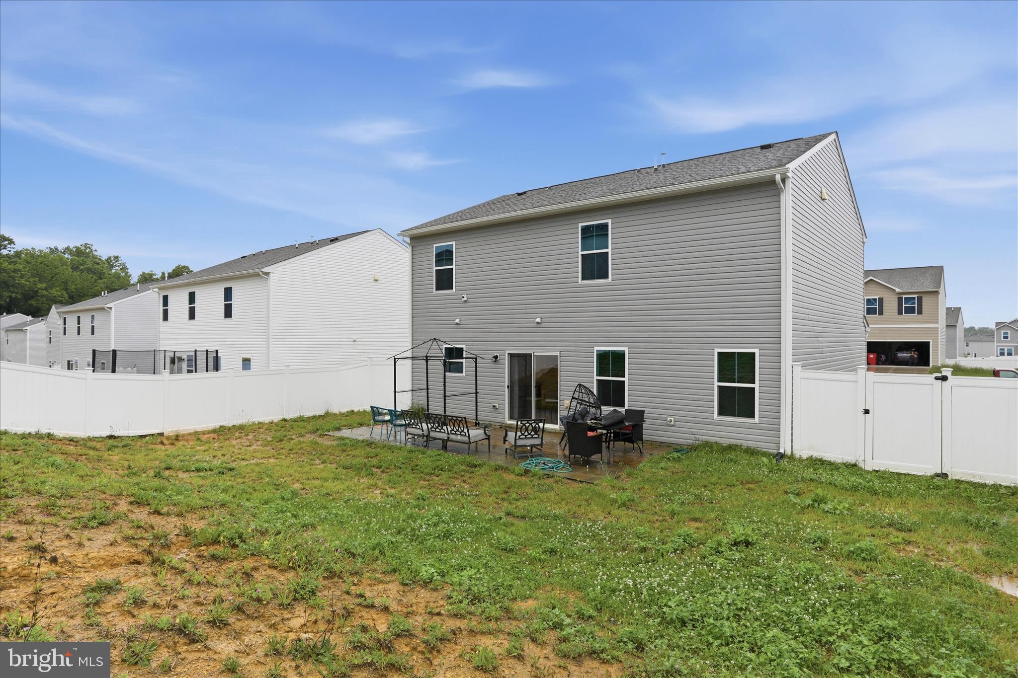 76 Diving Scaup Road Hedgesville, WV 25427 - Photo 32 of 48 a view of a house with backyard and sitting area