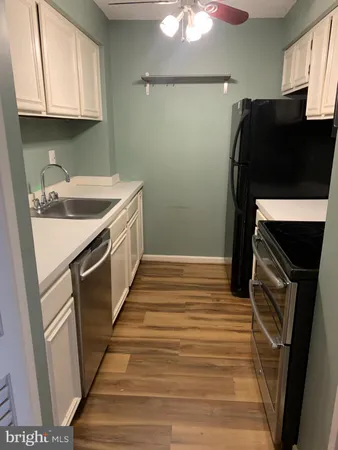 a kitchen with a sink and a stove