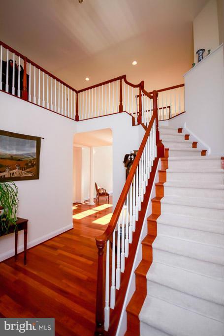 553 Houck Road Westminster, MD 21157 - Photo 16 of 30 a view of staircase with lots of frames on wall and wooden floor