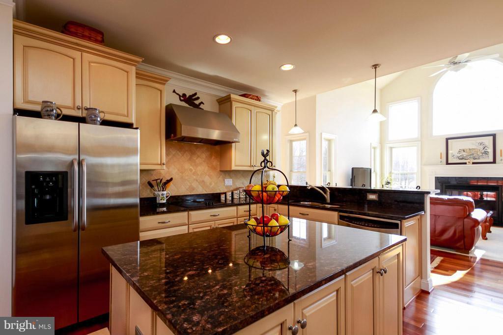 553 Houck Road Westminster, MD 21157 - Photo 3 of 30 a kitchen with stainless steel appliances granite countertop a sink stove and refrigerator