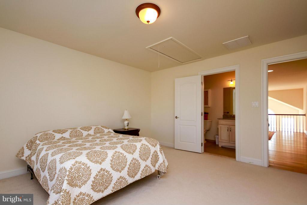 553 Houck Road Westminster, MD 21157 - Photo 25 of 30 a bedroom with a bed and a lamp