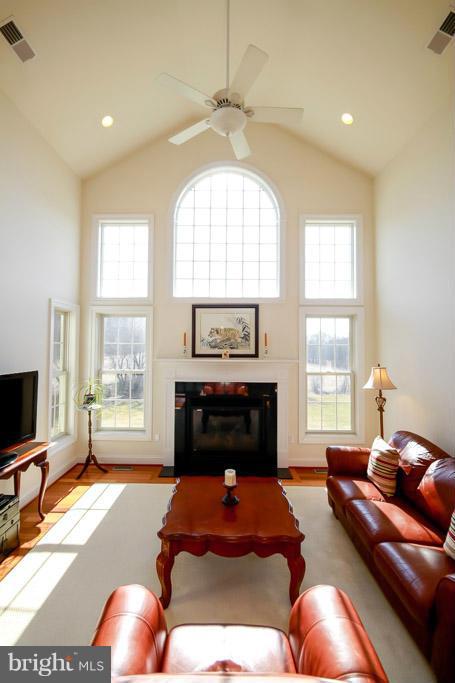 553 Houck Road Westminster, MD 21157 - Photo 6 of 30 a living room with furniture a fireplace and a flat screen tv