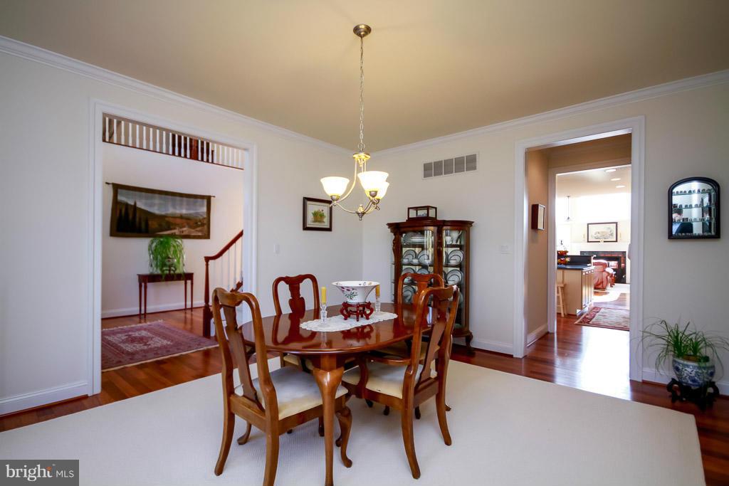 553 Houck Road Westminster, MD 21157 - Photo 8 of 30 a view of a dining room with furniture and wooden floor