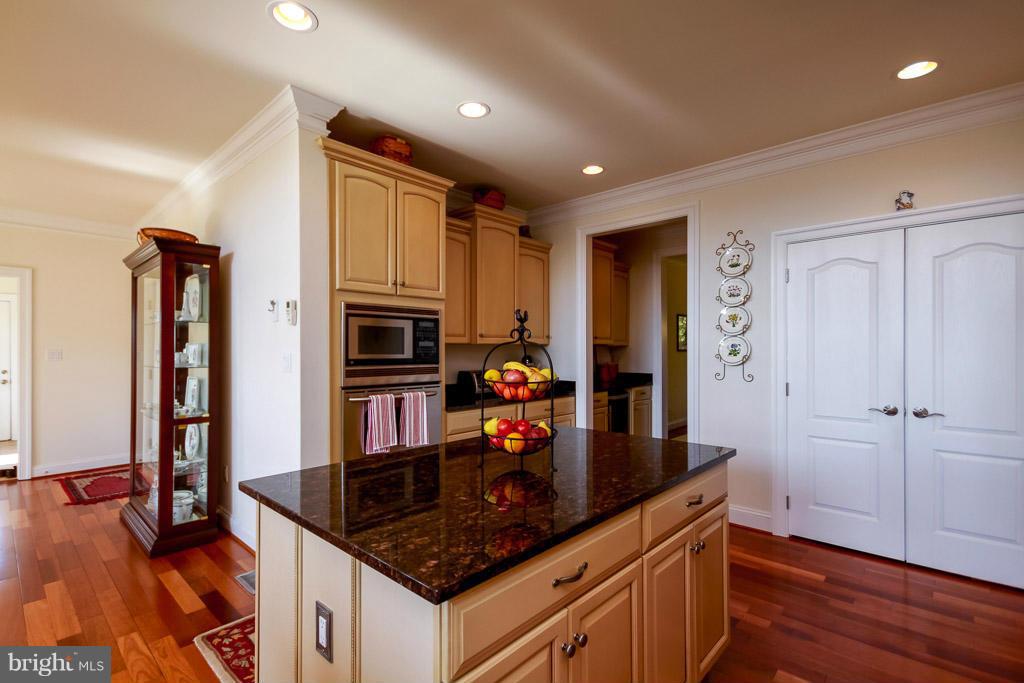 553 Houck Road Westminster, MD 21157 - Photo 10 of 30 a kitchen with stainless steel appliances granite countertop a stove and a refrigerator