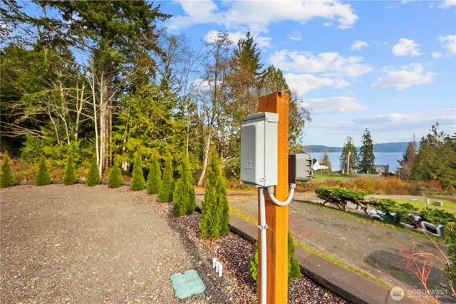 a view of a patio with table and chairs and potted plants