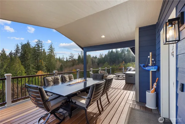 a living room with furniture a rug and a flat screen tv
