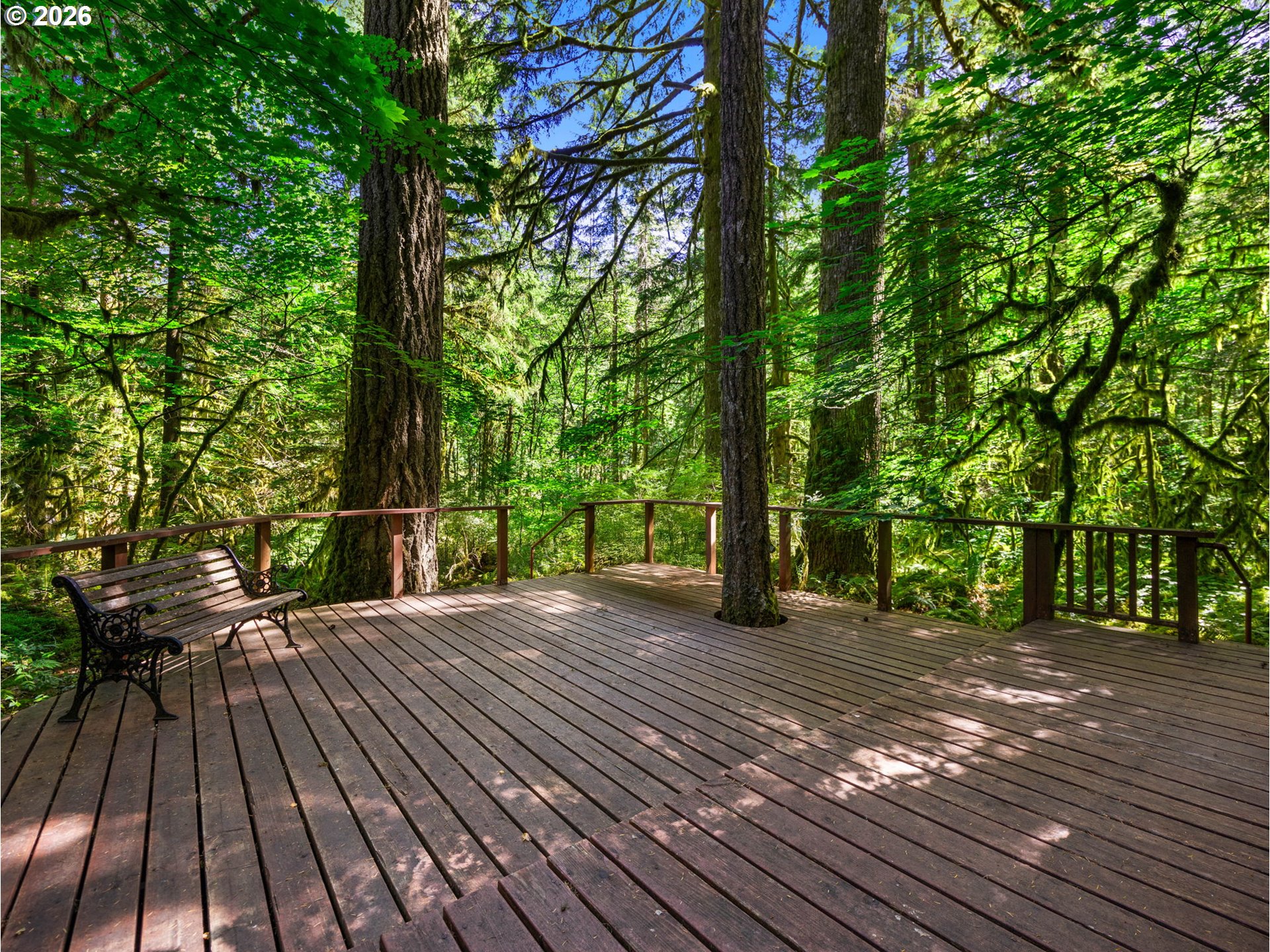 26811 East Road 15 Rhododendron, OR 97049 - Photo 2 of 47 a view of a backyard with a wooden deck