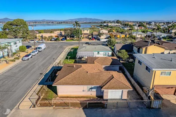 a aerial view of a house with a yard garage and outdoor seating