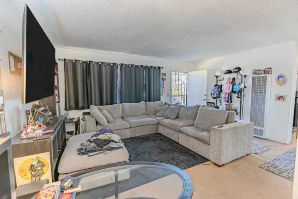 a kitchen with stainless steel appliances a sink stove and a refrigerator