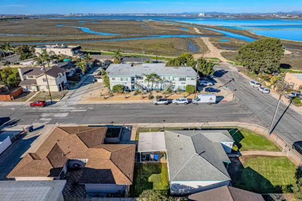 an aerial view of residential houses with outdoor space