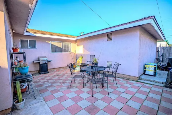 a view of a chairs and table in a patio