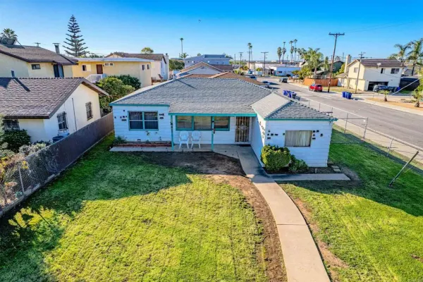 a view of a yard in front of a house