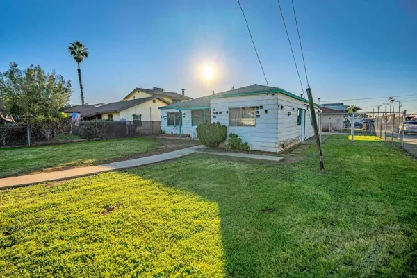 a house view with a backyard space