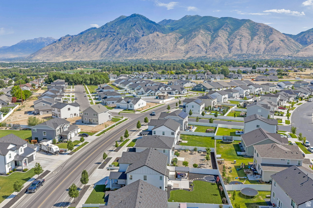 252 North Sunrise Rnch Drive Mapleton, UT 84664 - Photo 57 of 62 Expansive aerial view showcasing a residential community with diverse home exteriors, mountain scenery, and established roadways