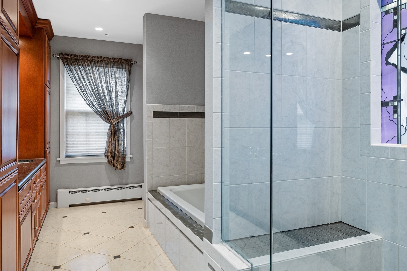 921 Pontiac Road Wilmette, IL 60091 - Photo 19 of 40 a bathroom with a bathtub and a shower
