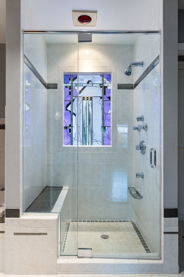 921 Pontiac Road Wilmette, IL 60091 - Photo 21 of 40 a bathroom with a bathtub and shower