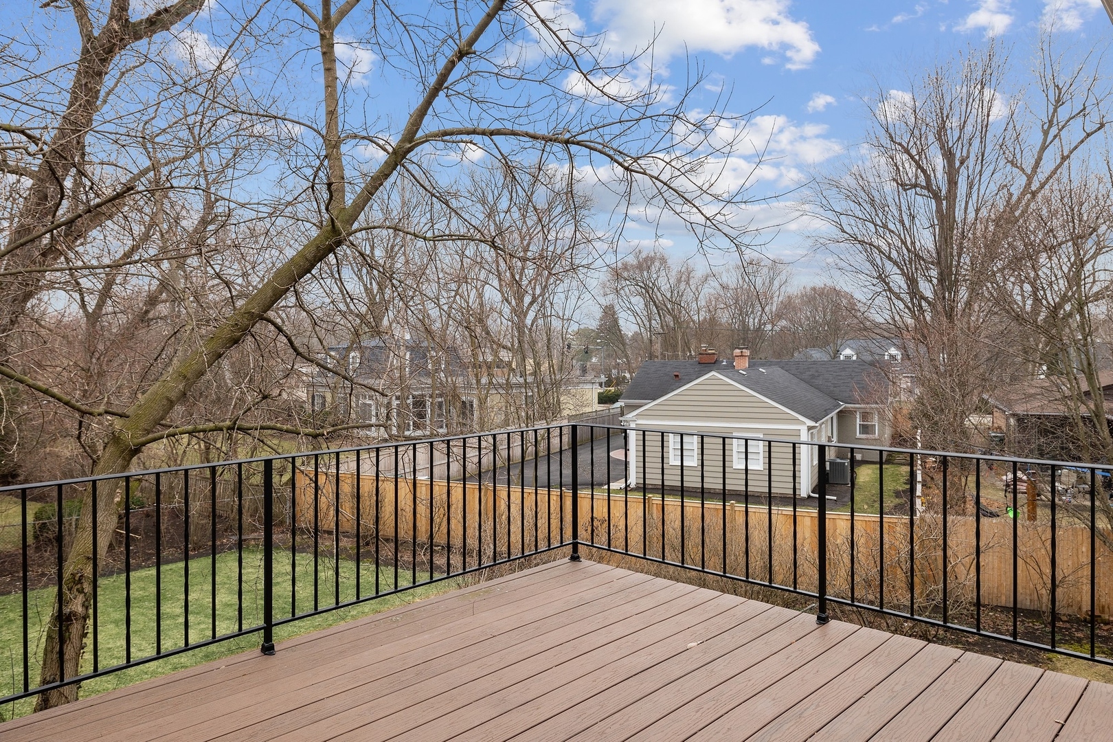 921 Pontiac Road Wilmette, IL 60091 - Photo 27 of 40 a view of a wooden deck and a yard