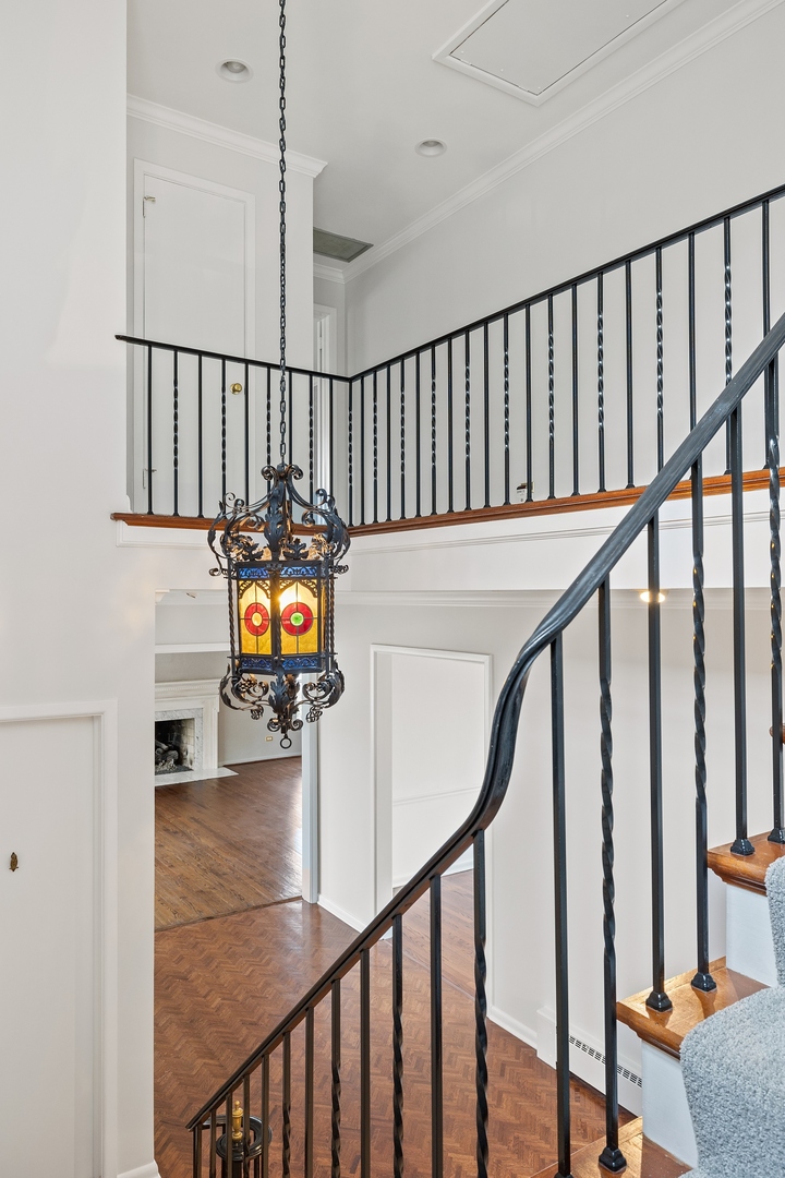 921 Pontiac Road Wilmette, IL 60091 - Photo 30 of 40 a view of staircase with railing and wooden floor