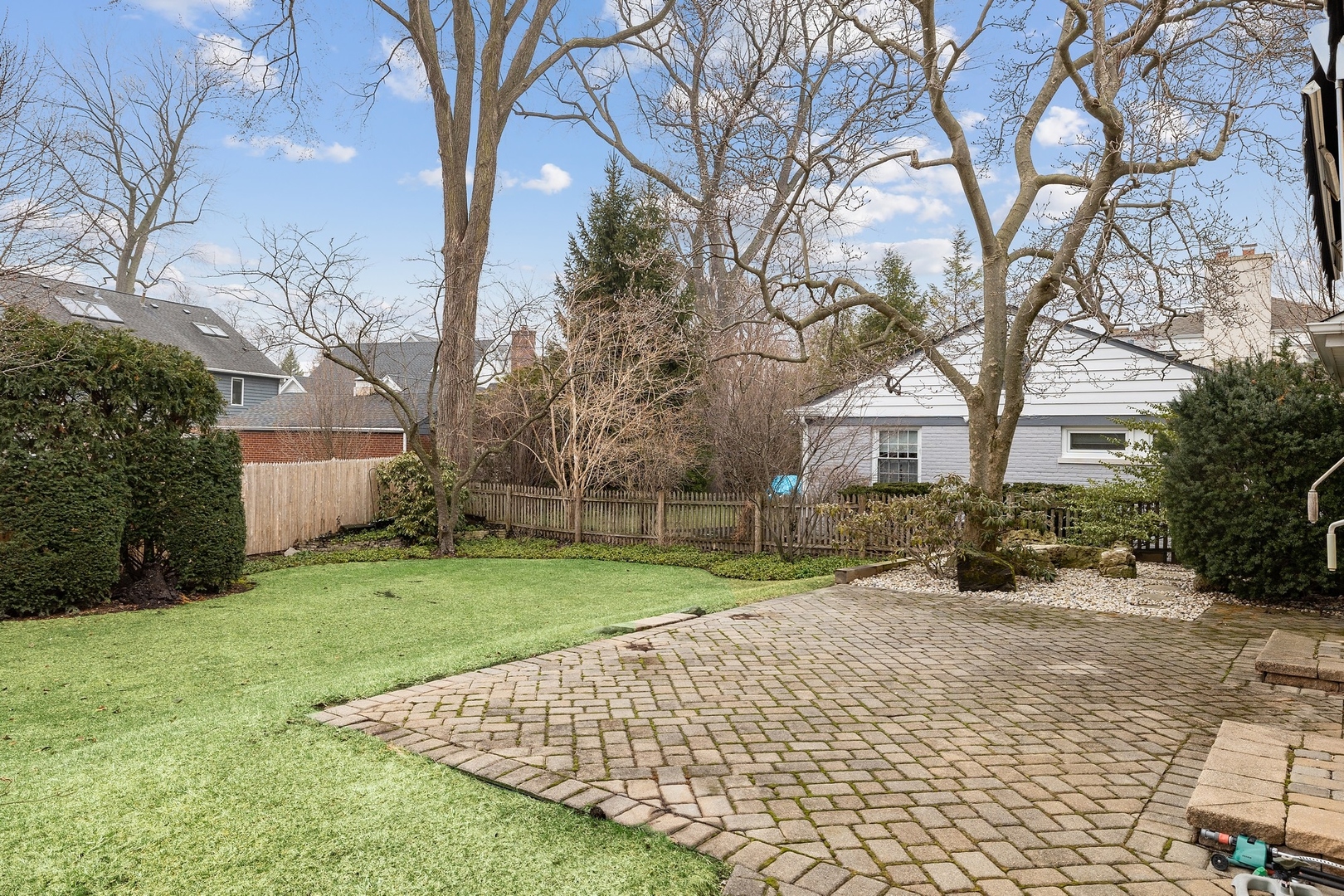 921 Pontiac Road Wilmette, IL 60091 - Photo 36 of 40 a front view of a house with a yard and trees