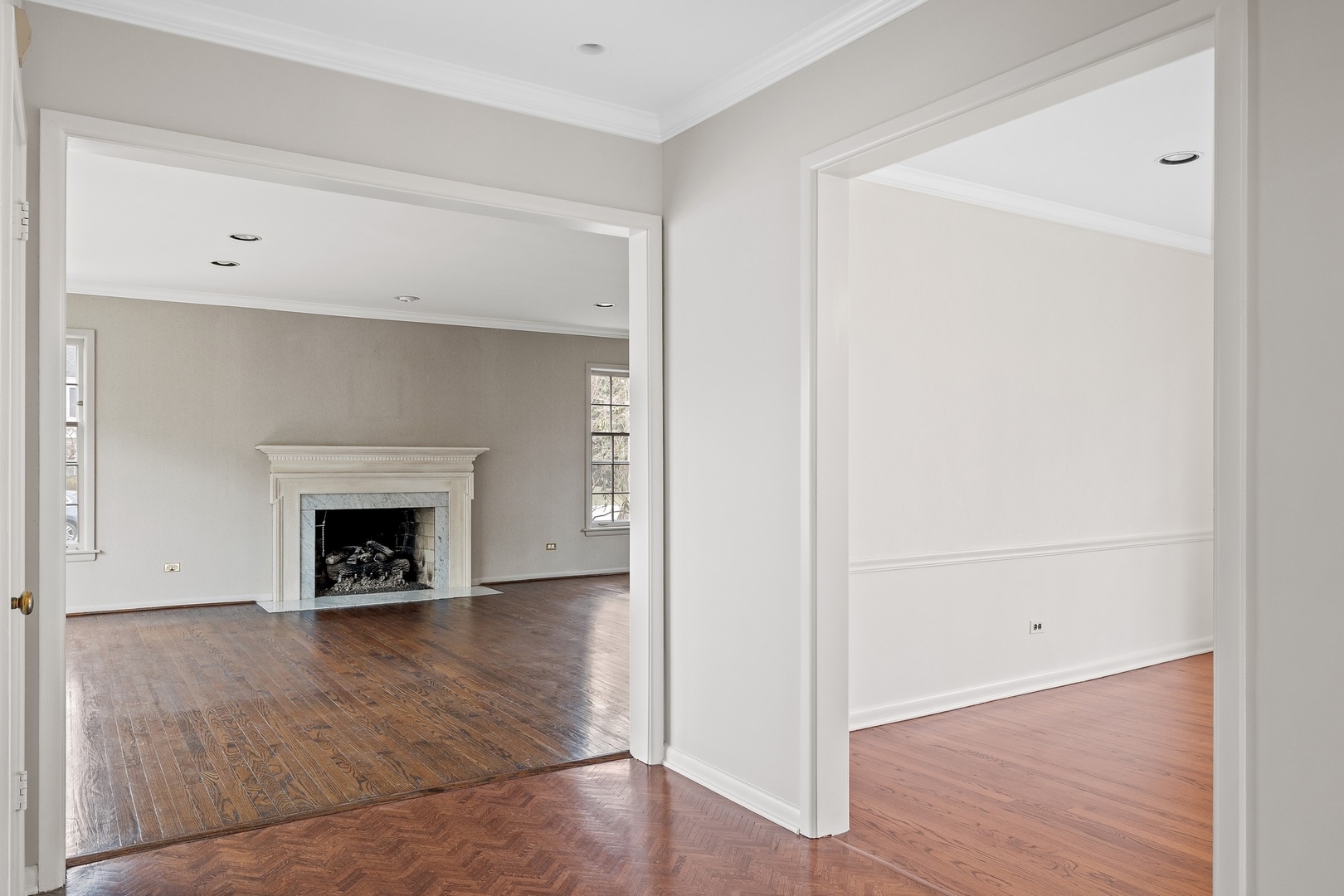 921 Pontiac Road Wilmette, IL 60091 - Photo 5 of 40 a view of an empty room with wooden floor and a window