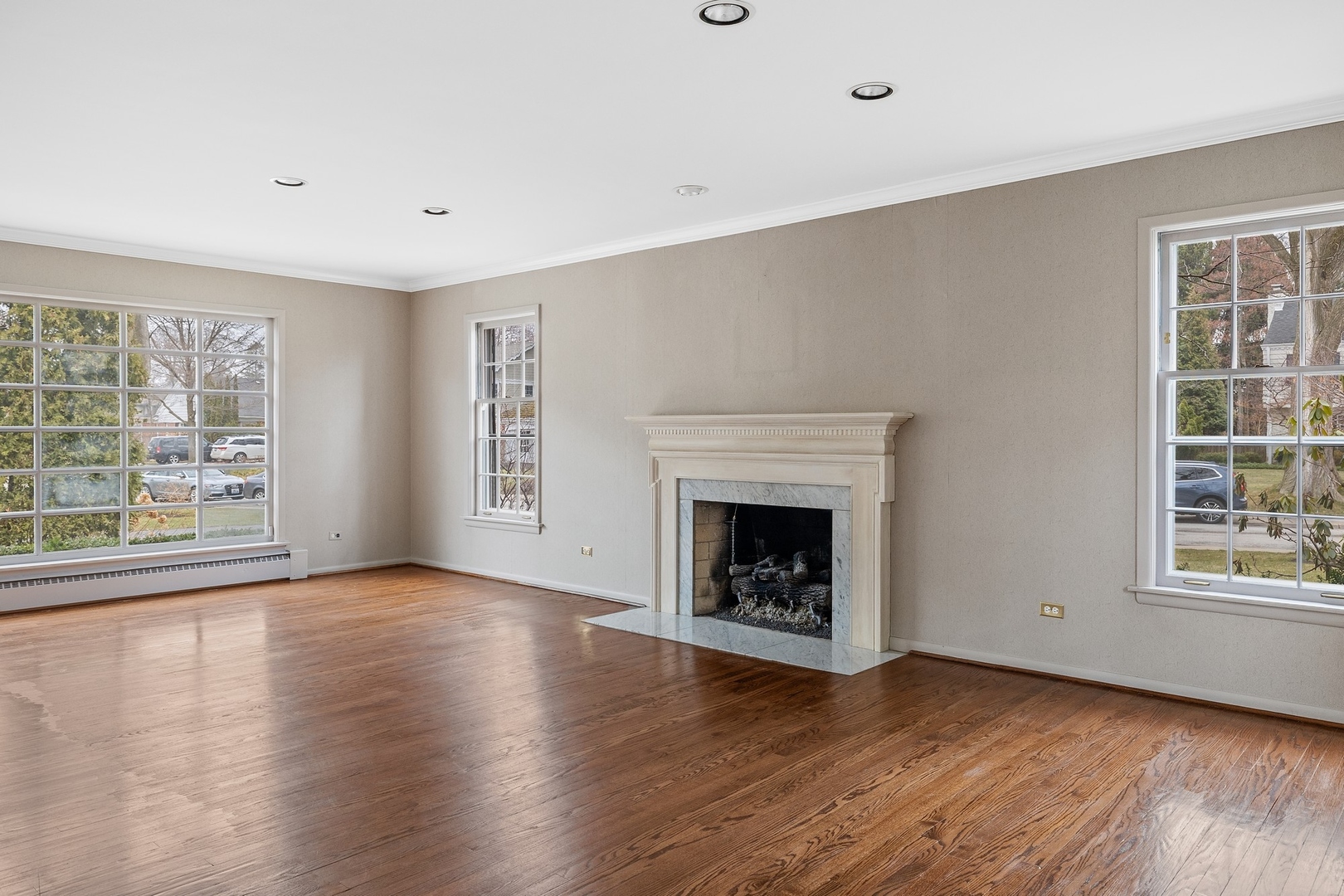 921 Pontiac Road Wilmette, IL 60091 - Photo 7 of 40 wooden floor fireplace and windows in an empty room