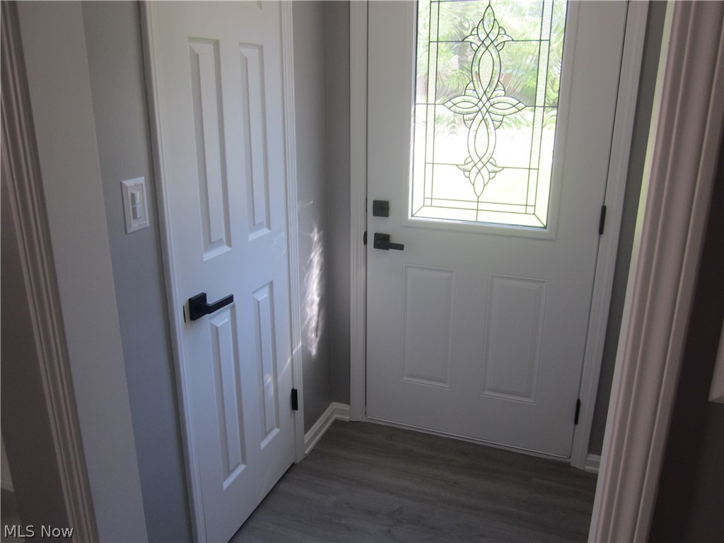 1810 Lorimer Road Cleveland, OH 44134 - Photo 15 of 47 Doorway to outside featuring dark hardwood / wood-style flooring