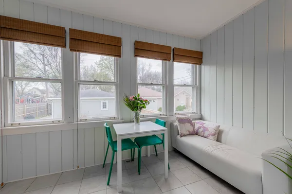 a living room with furniture and windows